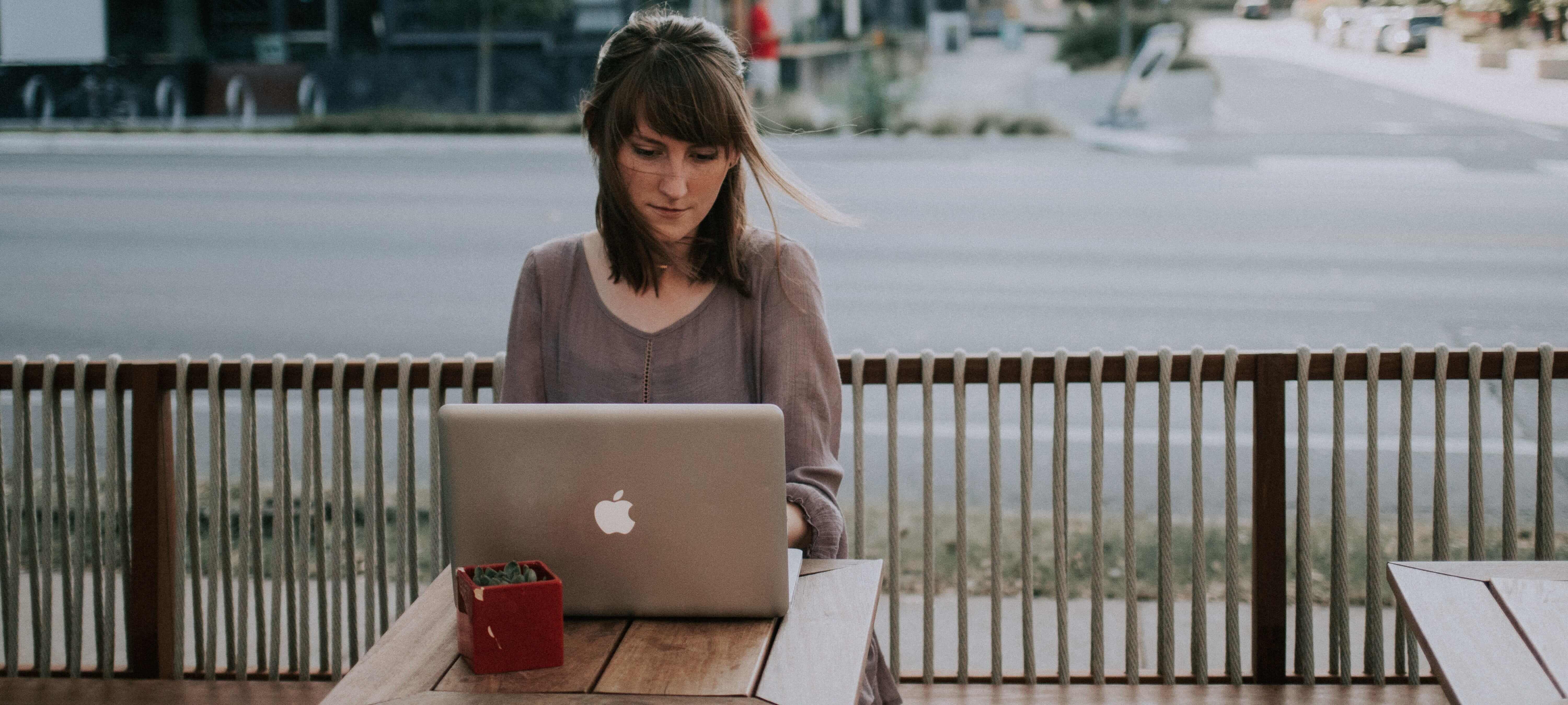 woman taking a TEFL course on her laptop